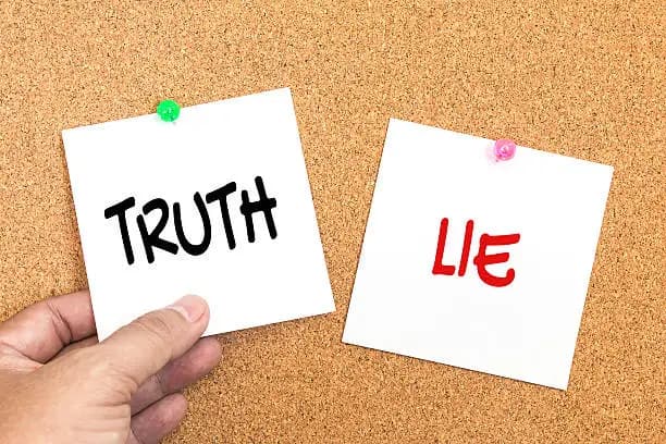 “Truth” and “Lie” written on paper
